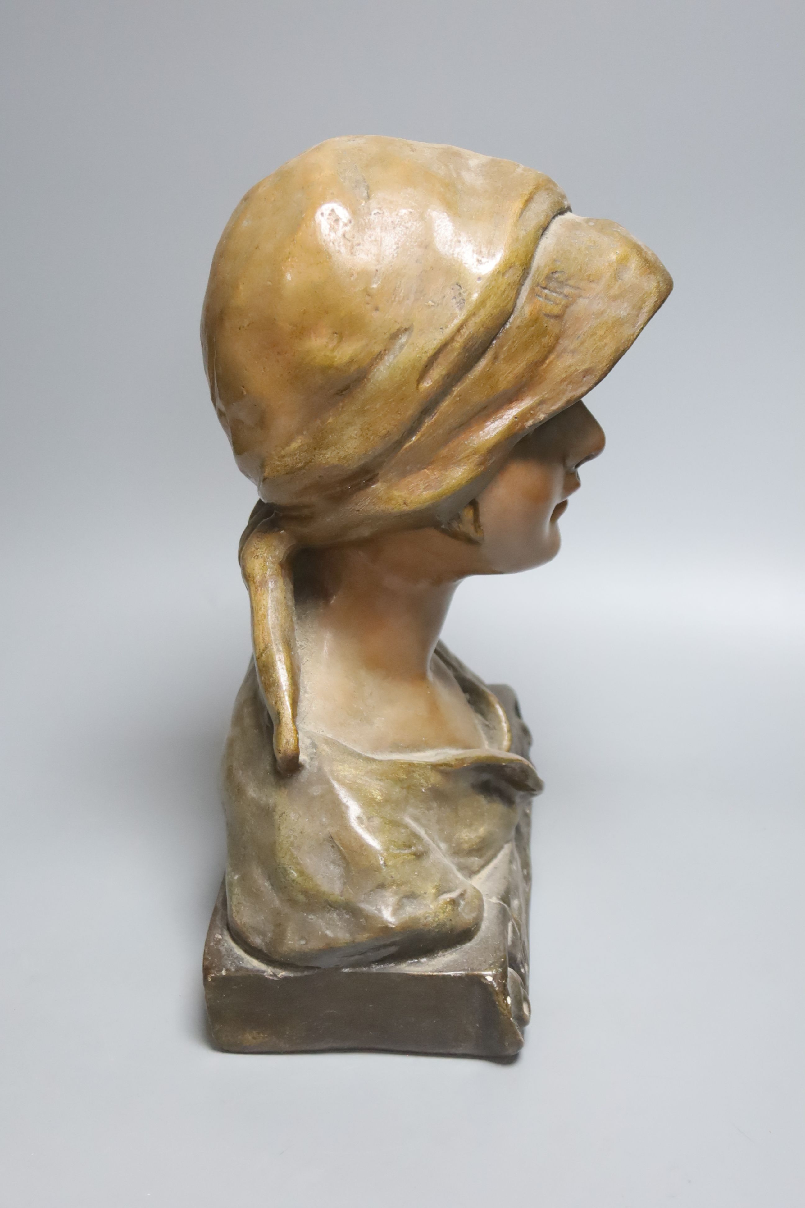 An Art Nouveau plaster bust of a peasant girl in headscarf, numbered 139, height 33cm